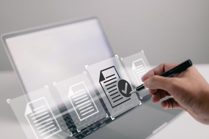 Using a laptop with a virtual screen and document for paperless Using a laptop with a virtual screen and document for paperless quality assurance and online ERP clearance.